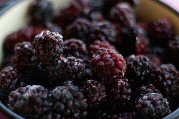 Healthy sweets concept frozen raspberries, blackberries
