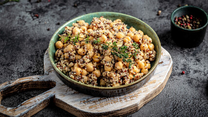 Healthy vegetable lunch from the Buddha bowl with quinoa, chickpeas and thyme. Super food, top view