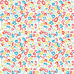 Happy colorful leopard skin spots in pink, green, yellow and red colors on white background. Vektor seamless pattern for kids fashion, T-shirts, fabrics, decorations, covers, wrapping, backdrops.
