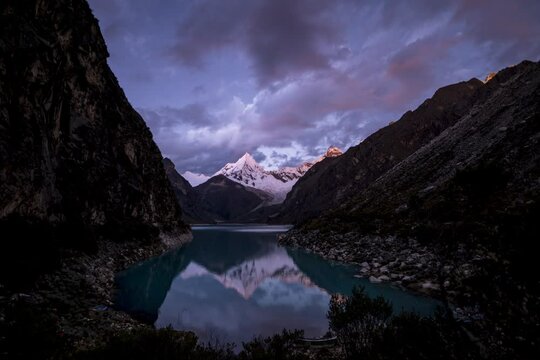 timelapse of laguna paron in the high andes mountains of the cordillera blanca at huascaran, Peru. Holy grail timelapse day to night with stary sky and milky way