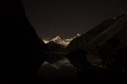 timelapse of laguna paron in the high andes mountains of the cordillera blanca at huascaran, Peru. Holy grail timelapse day to night with stary sky and milky way