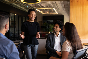 african american woman sharing toughts and ideas with the team in office workspace. .