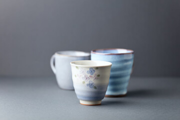 Traditional, handcrafted ceramic on gray background. Soft focus. Copy space.