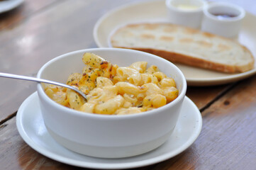 cheese macaroni, macaroni with cheese topping or eating macaroni and  toast