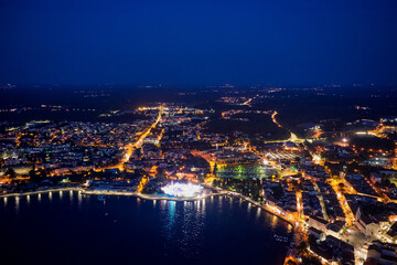 Fototapeta na wymiar Top view of the night city of Porec in Croatia. Aerial photography.