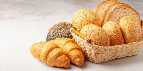 Assortment of freshly baked breads. Buns and croissants.