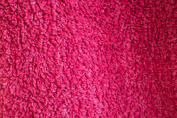 Red cotton towel or carpet.fluffy texture background. Close up photo.