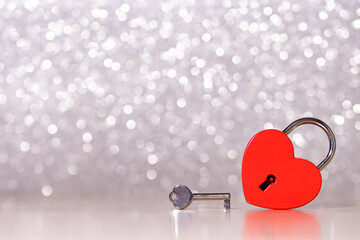 padlock red heart with key on background with bokeh, love concept