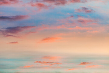 Fototapeta na wymiar fantastic colorful sky at sunrise with small split clouds