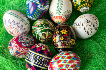 Colorful Easter eggs on a green background