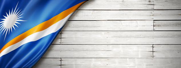Marshall Islands flag on old white wall banner