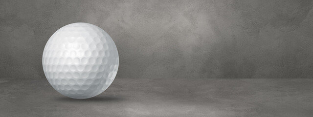 White golf ball on a concrete studio banner