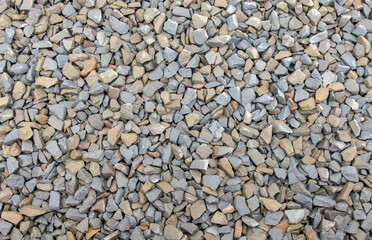 Chipped natural stone. Crushed stone from granite. Macro photo of rubble with place for text