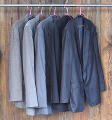 set of business suit jackets on a hanger