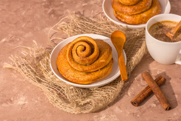 Freshly baked cinnamon bun stuffed with spices and cocoa . Sweet homemade cakes.