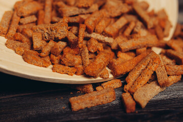 croutons on a plate snacks for beer snack wooden table