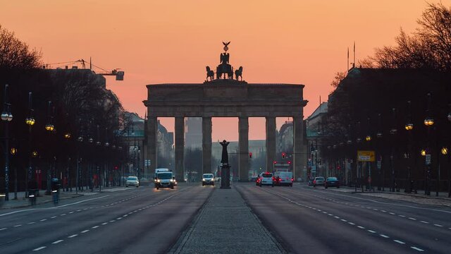 Sunrise Time Lapse of Brandenburg Gate with traffic on the street, Berlin, Germany
