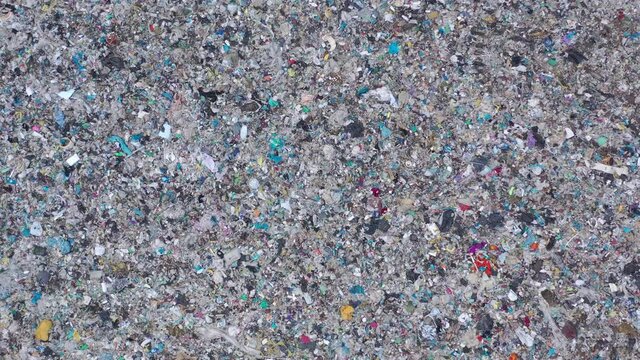 Aerial top drone view of large garbage pile, trash dump, landfill, waste from household dumping site, garbage background. Consumerism and contamination concept