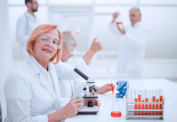 female scientist conducts a blood test in the laboratory.