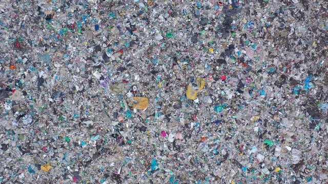 Aerial top drone view of large garbage pile, trash dump, landfill, waste from household dumping site, garbage background. Consumerism and contamination concept