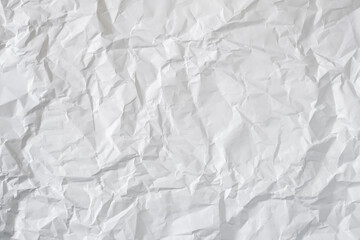Crumpled white paper as a background.