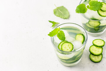 Infused cucumber iced water. Space for text, top view.