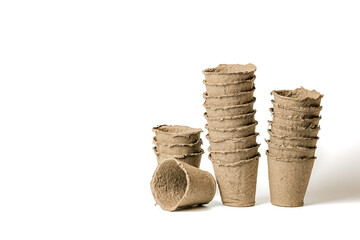 Eco-friendly biodegradable fiber pots for growing sowing seeds isolated on white background