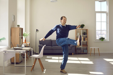 Proper sport activity in home office, workplace fitness concept. Mature freelance worker exercising...