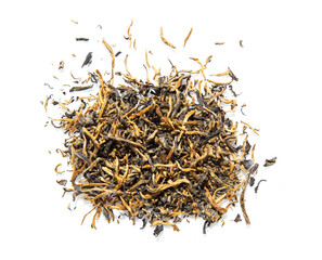 Chinese dry black (red) tea with tips and tea flushes, isolated on white background.