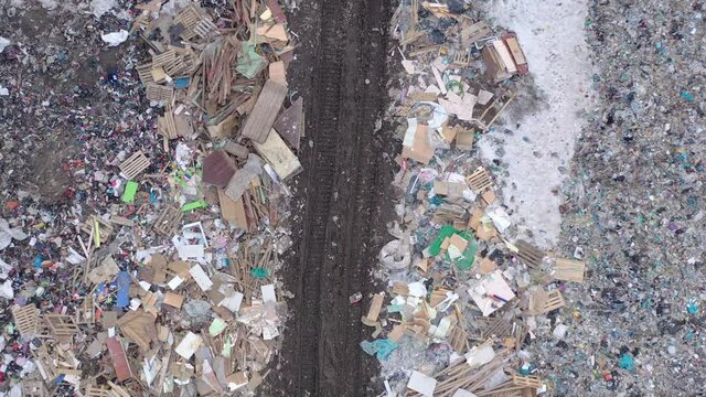 Aerial top drone view of large garbage pile, trash dump, landfill, waste from household dumping site, garbage background. Consumerism and contamination concept