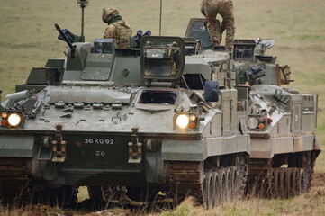 british army FV512 warrior MRV preparing to tow a stricken warrior FV510 light infantry fighting...