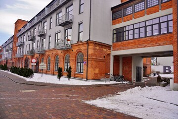 Fototapeta na wymiar Architecture in Lodz. Housing estate and hotel . Mix of old and modern architecture. Winter day 