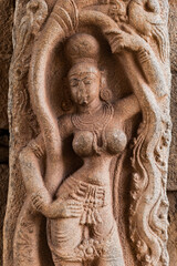 Fototapeta na wymiar Examples of ancient architecture. The figure of the goddess on the wall of the destroyed Krishna Temple in Hampi, Karnataka, India
