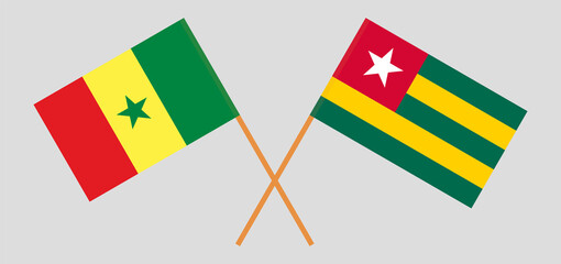 Crossed flags of Senegal and Togo. Official colors. Correct proportion