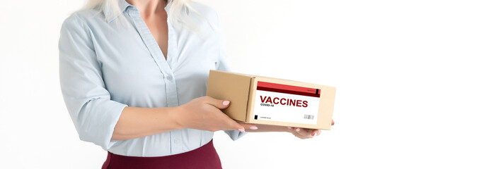 Attractive positive blond lab assistant carrying box with vaccines for Covid 19. on a white...
