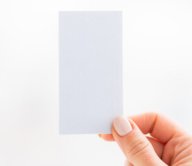Hand holding empty white business card