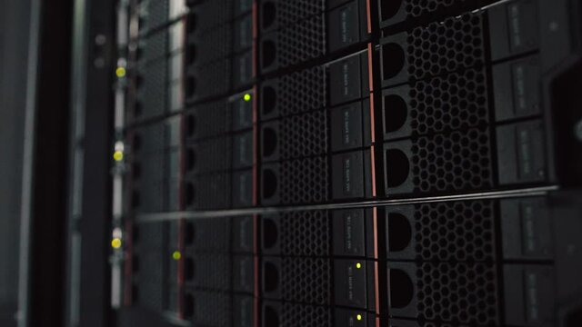 Network and data servers and panels in a server room of a data center or ISP with flickering lights