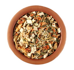 Dry cut and chopped up vegetables mix, spice in clay pot isolated on white background, top view