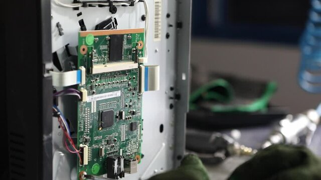 Obsolete computer parts being recycled for reuse or safe disposal - isolated close up