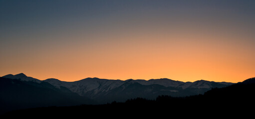 Fototapeta na wymiar Sunset colors above mountains