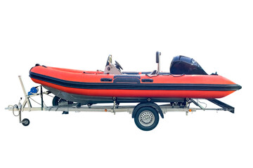 orange inflatable boat on a trailer isolated on white background