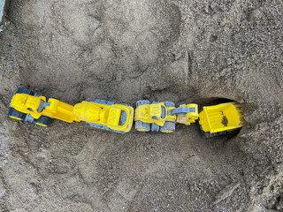 toy trucks in the sand