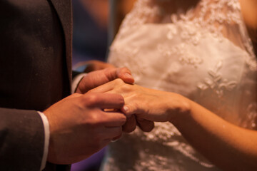 the bride and groom exchange rings. High quality photo