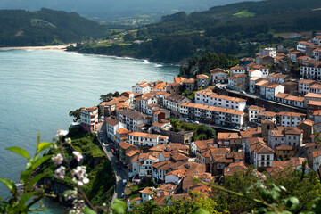 Naklejka na ściany i meble beautiful view of the town of Lastres, Asturias with the Cantabrian coast and the mountains in the background