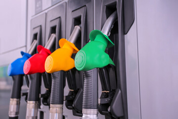 Detail of a petrol pump in a petrol station.Close up on fuel nozzle in oil dispenser with gasoline...