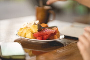 Dish with cut fruit salad