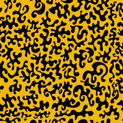 seamless background with black blots on bright yellow canvas