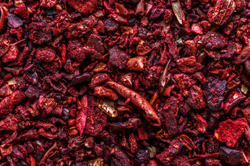 Fototapeta premium Dried dehydrated tomato. A mixture of different spices close up. Textures of colorful spices and condiments.Colorful Herbal and Spices Oriental.Various Indian spices