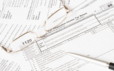 Tax Form with glasses and pen. Tax concept