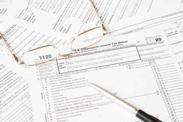 Tax Form with glasses and pen. Tax concept